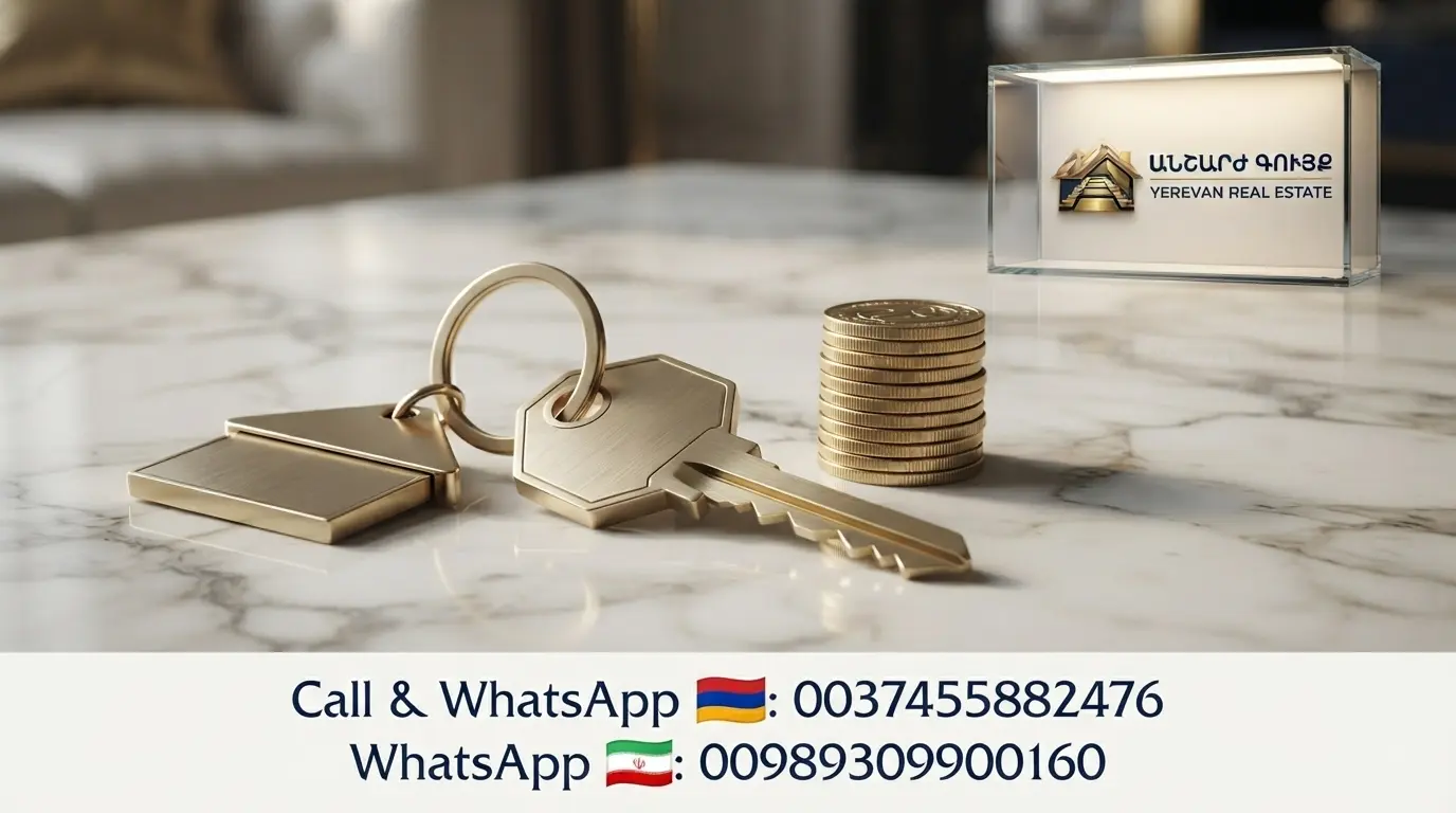 House key with keychain and Armenian Dram coins on marble table representing rental deposit cost in Yerevan