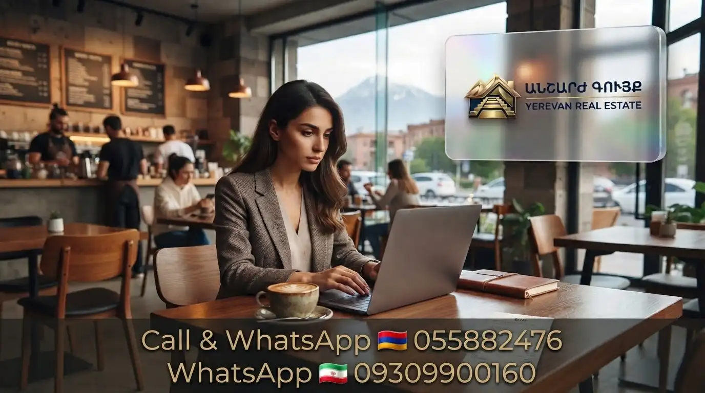 A young woman working on a laptop in a cozy Yerevan café with Ararat mountain view